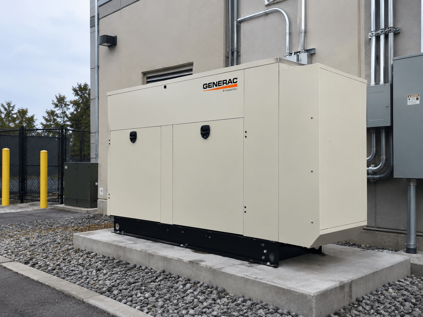 Generac Protector commercial standby generator installed beside a commercial building